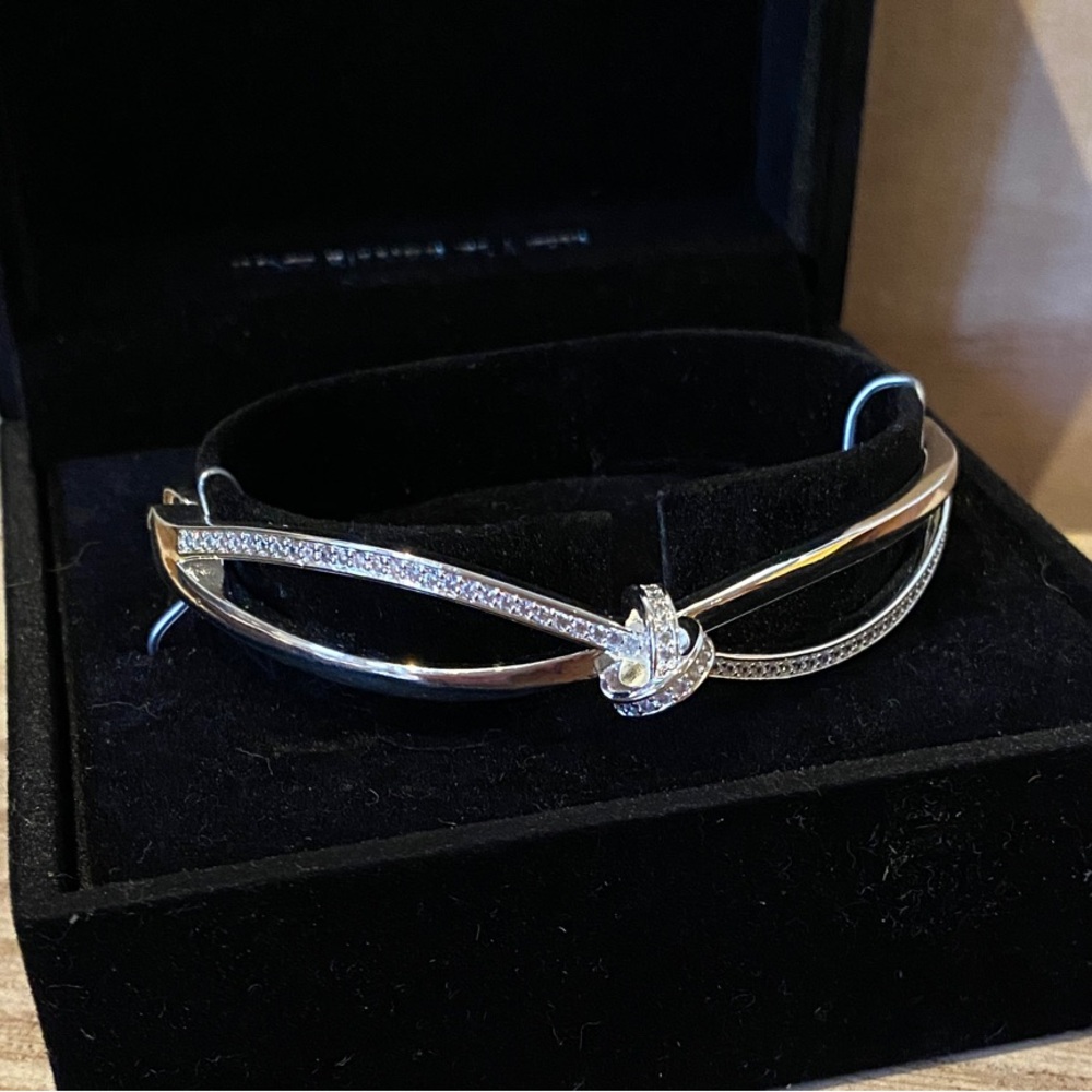 NWT Elegant Fine Silver Plate and crystal Knot Bracelet with push clasp